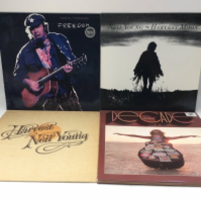 Four Neil Young LPs comprising 'Harvest', 'Freedom', 'Harvest Moon' and 'Decade'.