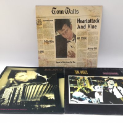 Three Tom Waits LPs comprising 'Heart Attack And Vine', 'Swordfishtrombones' and 'Frank's Wild Years'.