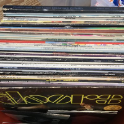 A box of LPs by various artists including Frankie Goes Tao Hollywood, Jackson Browne, The Doors and others plus some 7" singles.