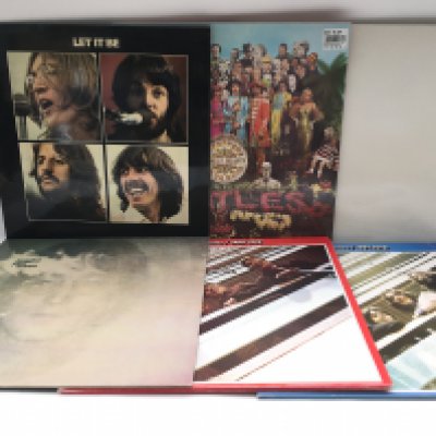 Thirteen Beatles and solo LPs including 'Let It Be', 'Imagine' complete with inserts, 'Extra Texture' and others.