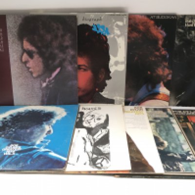 Two bags of 18 Bob Dylan LPs comprising 'Blood On The Tracks', a 5LP 'Biograph' box set, 'Desire' and others.