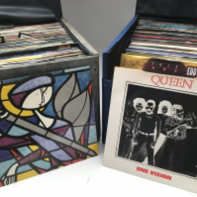 Four record cases of 7" singles, mainly 1980s rock and pop artists including OMD, Duran Duran, Madonna and many more.