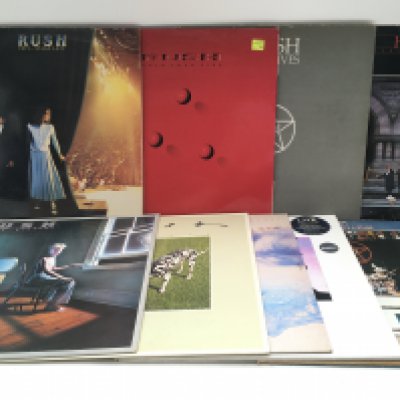 Eighteen Rush LPs and 12" singles comprising 'Power Windows', 'Hold Your Fire', 'Signals' and others.
