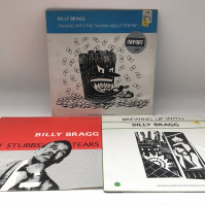 Three Billy Bragg LPs including a white vinyl 'Talking With The Taxman About Poetry', 'Brewing Up With' and 'Levi Stubbs' Tears'.