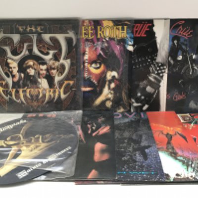 Eighteen rock LPs and 12" singles by various artists including Bon Jovi, Motley Crue, Meat Loaf and others.