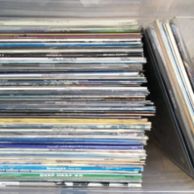 A box of LPs by various artists including Marvin Gaye, Stevie Winder, UB40 and others.