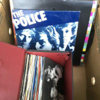 A box of mainly 1980s 7" and 12" singles by variouS artists including New Order, Cocteau Twins, The Pogues and others, also including a 2LP 10" 'Regatta De Blanc' LP by The Police.