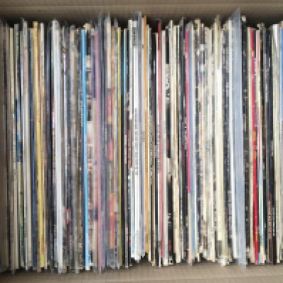 A box of 1970s rock LPs by various artists including David Bowie, Queen, Grateful Dead, Little Feat and others.