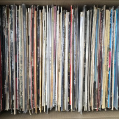 A box of LPs by various artists including Yardbirds, David Crosby, The Band and others.