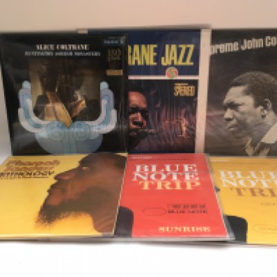 Two bags containing 12 jazz LPs by various artists including John Coltrane, Sonny Rollins, Donald Byrd and others. Includes original pressings and 180g reissues.