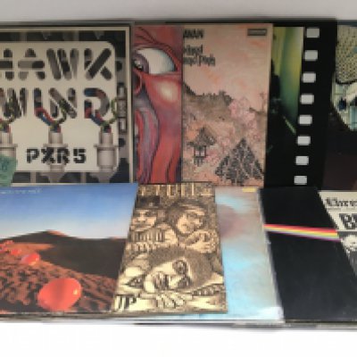 Ten prog rock LPs by various artists including King Crimson, Pink Floyd, Caravan and others. Also includes a Hawkwind ticket stub.