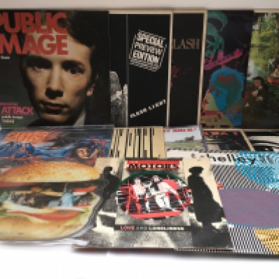 Two bags of punk and post punk LPs, 12" singles and coloured vinyl by various artists including PiL, The Clash, The Slits, The Damned and others.