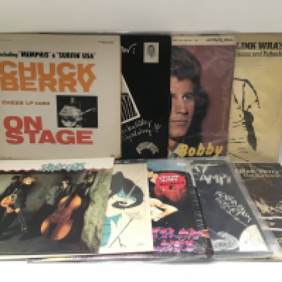 A collection of rock n roll and rockabilly LPs and 78s by various artists including Elvis Presley, Link Wray, Stray Cats and others.