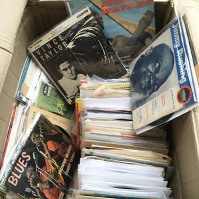 A box of rock n roll, rockabilly, blues and country 7" singles and EPs by various artists including Muddy Waters, Howling Wolf, Gene Vincent and many more.