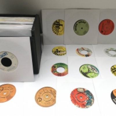 A record case of reggae 7" singles by various artists including Bob Marley, Prince Buster, Sugar Minott and many more. Includes Jamaican pressings.