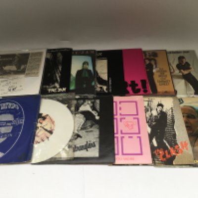 A collection of punk and post punk 7" singles by various artists including Sex Pistols, The Clash, The Jam (including a Rainbow Theatre ticket stub), The Damned and many more.