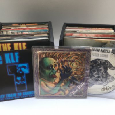 Two record cases of indie alternative and rock 7" singles by various artists including The Smiths, The Fall, KLF, Shed Seven and others. Includes some picture discs.