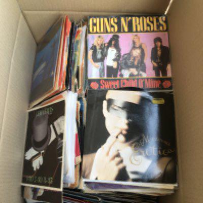Four boxes of 7" singles by various artists including The Rolling Stones, The Beatles,