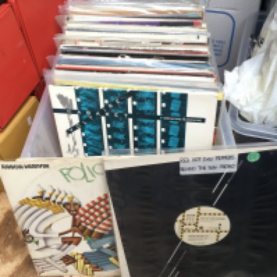 A box of 12" singles by various artists including Red Hot Chili Peppers (promo disc), The Pogues, Cabaret Voltaire, Junior Murvin and others.