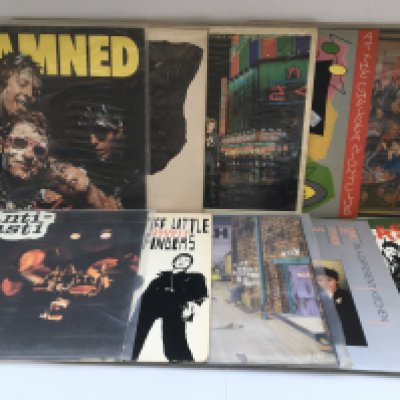 A Bush Acoustics metal record case containing over 50 punk rock LPs by various artists including Sex Pistols, The Clash, The Damned and others.