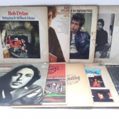 Two bags containing 18 folk rock LPs by various artists including Bob Dylan, Donovan, Neil Young and others. Condition varies.