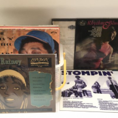 A box of blues and jazz LPs by various artists including Big Bill Broonzy, Billie Holiday and others.