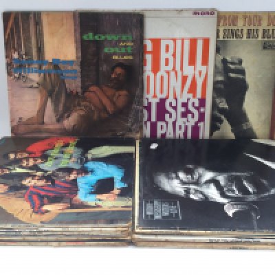 A record case of blues LPs by various artists including Muddy Waters, Big Bill Broonzy, Leadbelly and others. Condition varies.