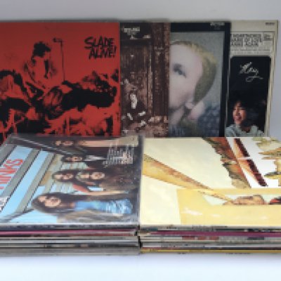 A collection of LPs by various artists including David Bowie, The Who, The Kinks and others.