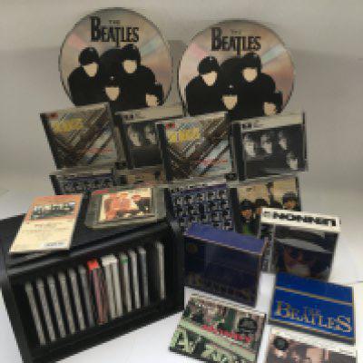 Three Beatles retail displays for CDs plus a Beatles CD bread bin (incomplete) and other CD sets.