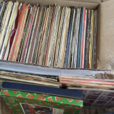 A box and a bag of LPs and 12" singles by various artists plus some empty sleeves (third and fourth photo).