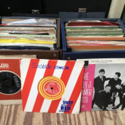 Seven record cases of 7" singles and EPs by various artists including Gene a Vincent, The Who, Little Richard and many more.