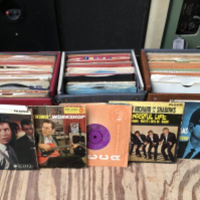 Eight record cases of rock n roll, rockabilly, soul and Western Swing 7" singles and EPs.