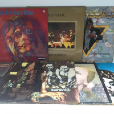 Fourteen rock LPs by various artists including Ten Years After, David Bowie, AC/DC, Deep Purple and others.