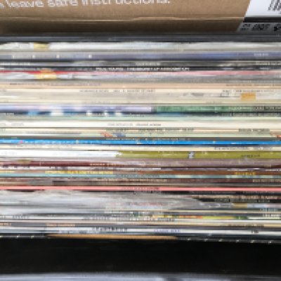 Four record cases and a box of LPs by various artists including Rush, War, a Little Feat, Bruce Springsteen and many more (5).