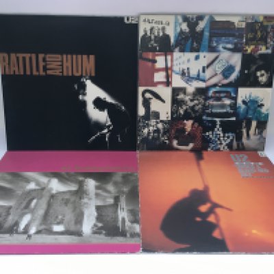 Four U2 LPs comprising 'Achtung Baby', 'Rattle And Hum', 'Under A Blood Red Sky' and The Unforgettable Fire'.