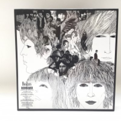 A Beatles 'Revolver' super deluxe 4LP edition on 180g vinyl with additional 7inch bonus EP and 100 page hardback book.