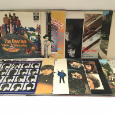 Fourteen Beatles LPs comprising mainly reissues on black and silver Parlophone labels. Includes foreign pressings of both 'Yellow Submarine' and 'Hey Jude'.