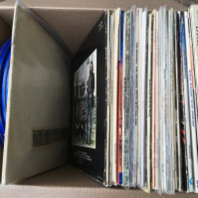 A box of LPs and 12" singles by various artists including a numbered Beatles 'White Album', fair condition with some scratches, no 0118409, plus other artists including The Who, Small Faces and others.