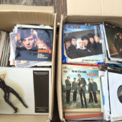 Two boxes of 7" singles by various artists from the 1960s onwards.