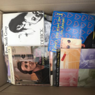A box of 7" singles b various artists including Patti Smith, AC/DC, Tom Verlaine and many more. Also includes three acetates for Petula Clark, Mark Wynter and one other unknown.