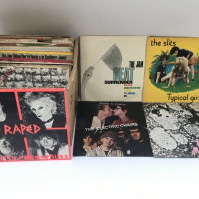 A collection of punk 7" singles by various artists including The Slits, Stiff Little Fingers, The Jam and others.