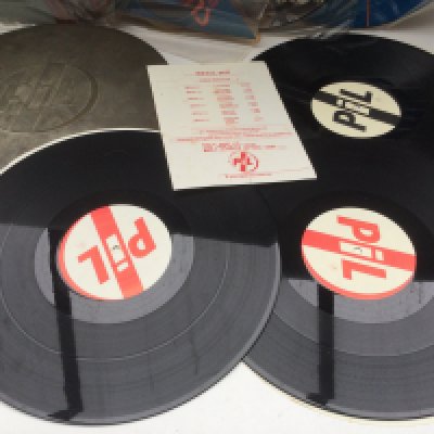 A PiL 'Metal Box' LP complete with inserts plus five various picture discs.