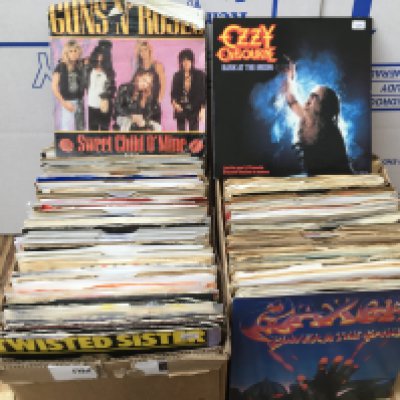 Four small boxes of 7" singles by various artists including Guns n Roses, Queen, Slade, ABBA and many more.