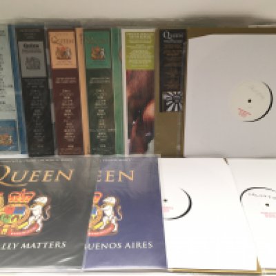 A box of Queen and related LPs and 12" singles including Japanese pressings, promos and coloured vinyl.