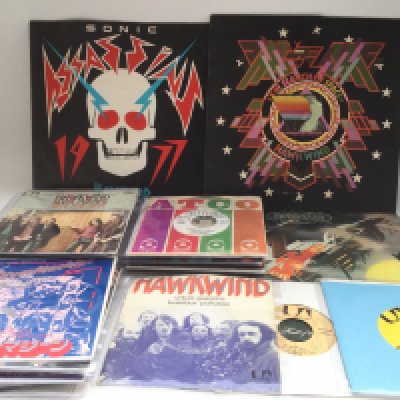 A collection of Hawkwind 7" singles and EPs including promo copies and foreign pressings plus three LPs. Also includes a signed 7".
