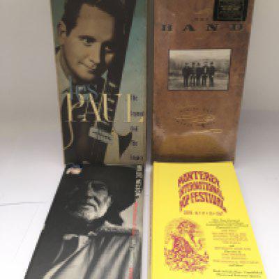 Four CD long box sets for various artists including Monterey International Pop Festival, The Band, Willie Nelson and Les Paul.