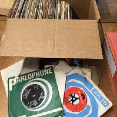 A box of 7" singles from the 1960s onwards.