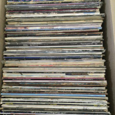 A box of LPs and 12" singles by various artists including David Bowie, Kate Bush, The Damned and many more.