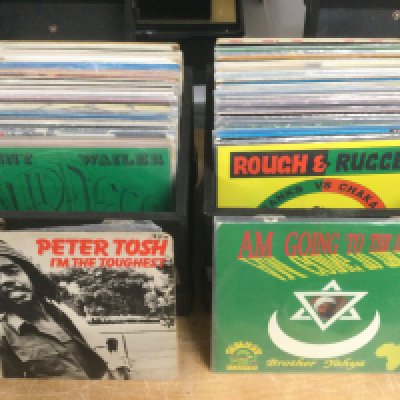 Two record cases of reggae LPs and 12" singles by various artists including Bunny Wailer, Peter Tosh, Dennis Brown and many more.