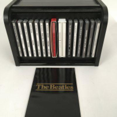 A Beatles 'bread bin' CD box set complete with booklet.